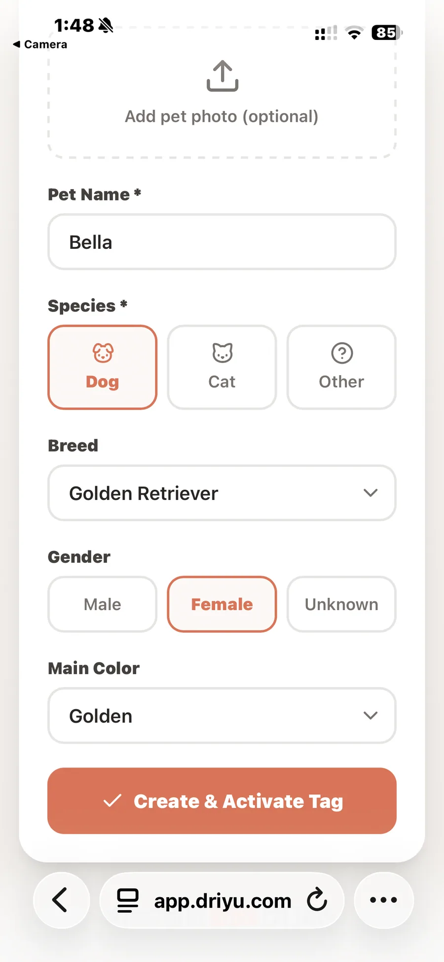 The pet profile form filled out for a golden retriever named Bella, ready to tap the orange Create and Activate Tag button.